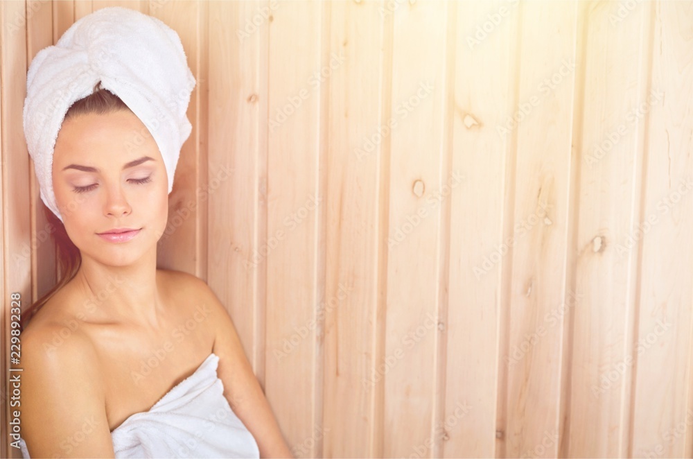 Portrait of beautiful young woman in white towel on head on Portrait of beautiful young woman in white towel on head on