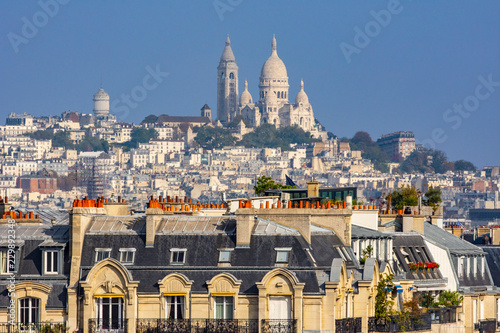Fototapeta Parisian buildings with montmartre and the sacre-coeur in the background, Paris,