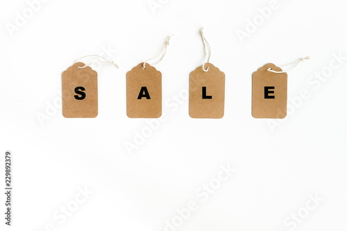 Black Friday sales tags concept. Craft paper tags on white background. Flat lay, top view , copy space.