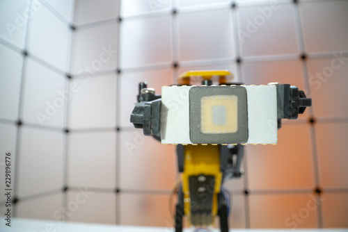 robot arm and ceramic body of the quantum processor chip, concept