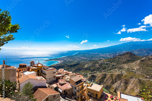 The bay of Giardini-Naxos, Taormina and the Etna viewed from the top of the Castelmola, Sicily, Italy. photo
