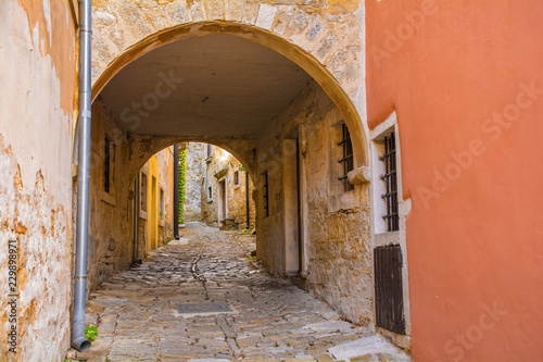An archway crossing a small street in the hill village of Groznjan  also called Grisignana  in Istria  Croatia  