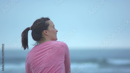 Woman Playing Catch on the Oregon Coast