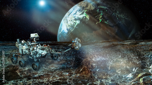 Fototapeta Naklejka Na Ścianę i Meble -  Rover on the Mars. Collage. Earht planet on the backstage. Elements of this image furnisfurnished by NASA.