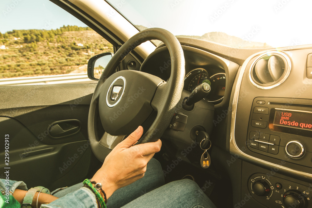 Hands catching a car steering wheel