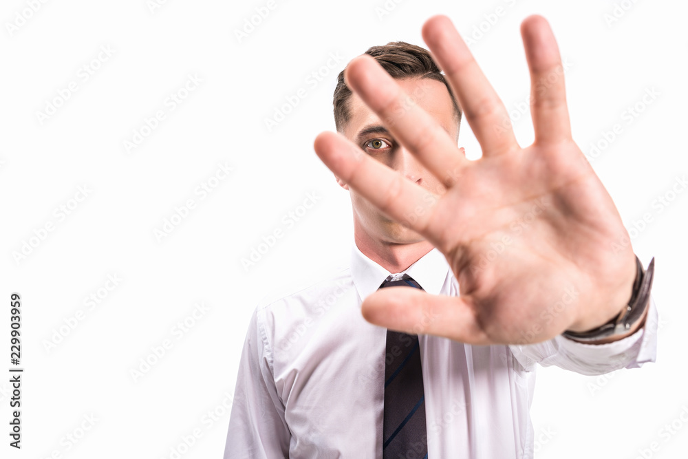 businessman in shirt and tie showing stop sign isolated on white businessman in shirt and tie showing stop sign isolated on white