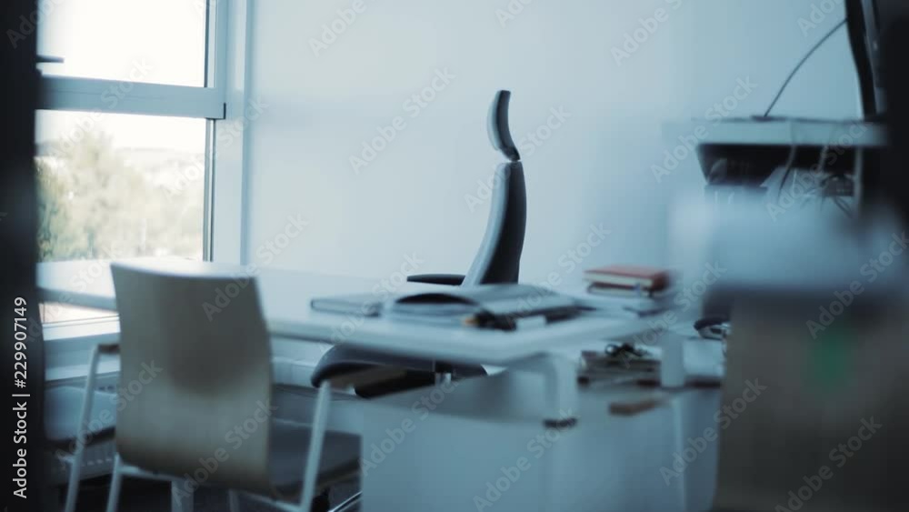 The interior view of a contemporary empty business office the chair returns inside papers comfortable empty design business nobody modern furniture work workplace paperwork architecture