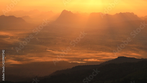 Beautiful scenery of mountains with sunrise in the morning © Aphisit
