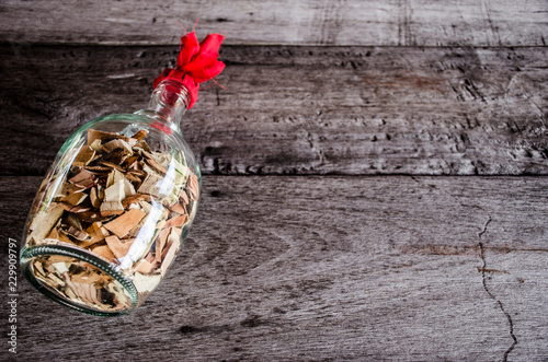 herbal liqour on wood background photo