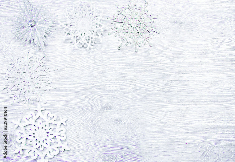 Fototapeta premium Christmas and New Year. Christmas toys, snowflakes on a wooden