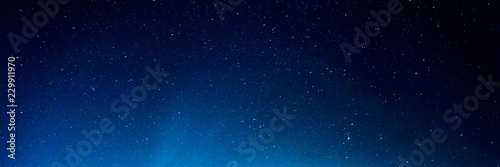 Horizontal background of the night starry sky © savelov