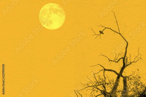 Bare tree with small bird and full moon on yellow background. Copy space for text or image. Elements of this image courtesy NASA.