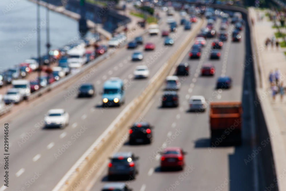 Blurred abstract background of traffic cars on the multi lane highway during rush hour Blurred abstract background of traffic cars on the multi lane highway during rush hour