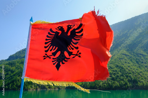 Albania, Shkoder, Komen Lake, Albanian Flag photo