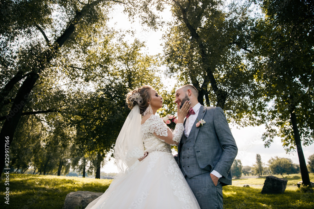 Bride and groom in a park.Wedding Couple.Wedding photo shooting