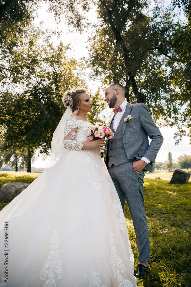 Bride and groom in a park.Wedding Couple.Wedding photo shooting