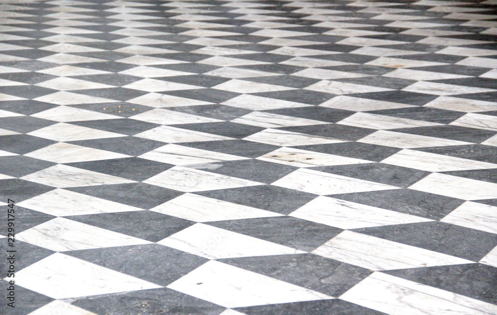 Naklejka premium Black and white checkered marble floor pattern