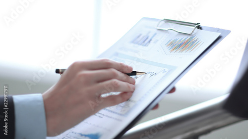 Close up businessman working with graph data at office