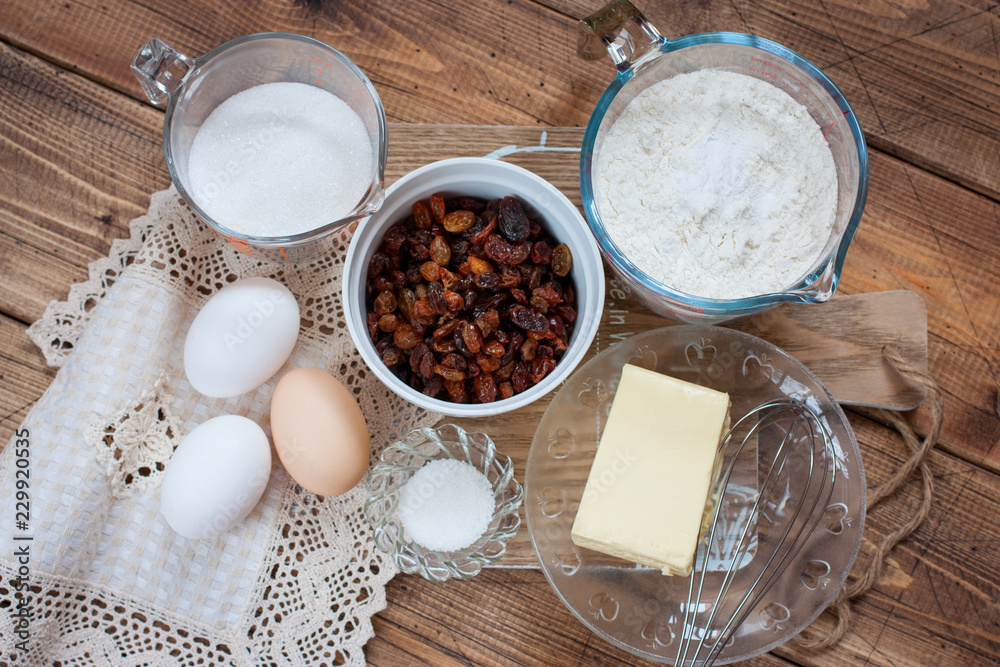Step by Step Cooking of Raisin Cake - Necessary Ingredients, Top View Step by Step Cooking of Raisin Cake - Necessary Ingredients, Top View