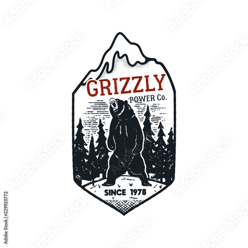 Wanderlust Logo Emblem. Vintage hand drawn travel badge. Featuring Grizzly Bear in the forest scene. Included custom adventure quote. Stock vector hike distressed insignia. Silhouette