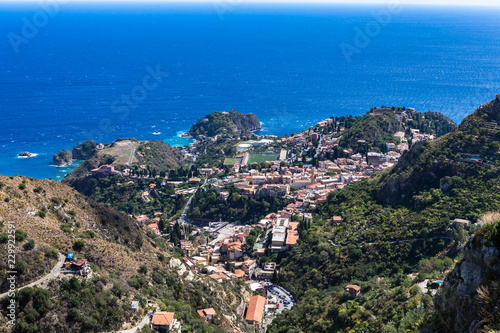 Obraz na płótnie The view from the small village Castelmola at mountain top above Taormina, with the view of Mediterranean Sea and the skyline of Taormina. w salonie