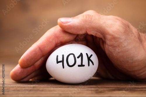 Man Protecting 401k White Egg photo