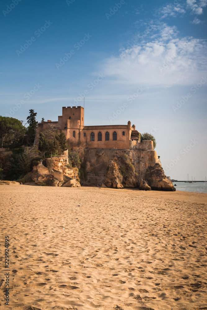 Beach and a castle in Portimao, Portugal