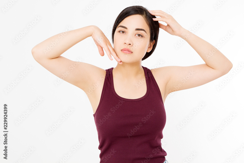 Skin care and armpit concept. Make up and cosmetics. Young asian woman isolated on white background in summer shirt. Copy space. Skin care and armpit concept. Make up and cosmetics. Young asian woman isolated on white background in summer shirt. Copy space.