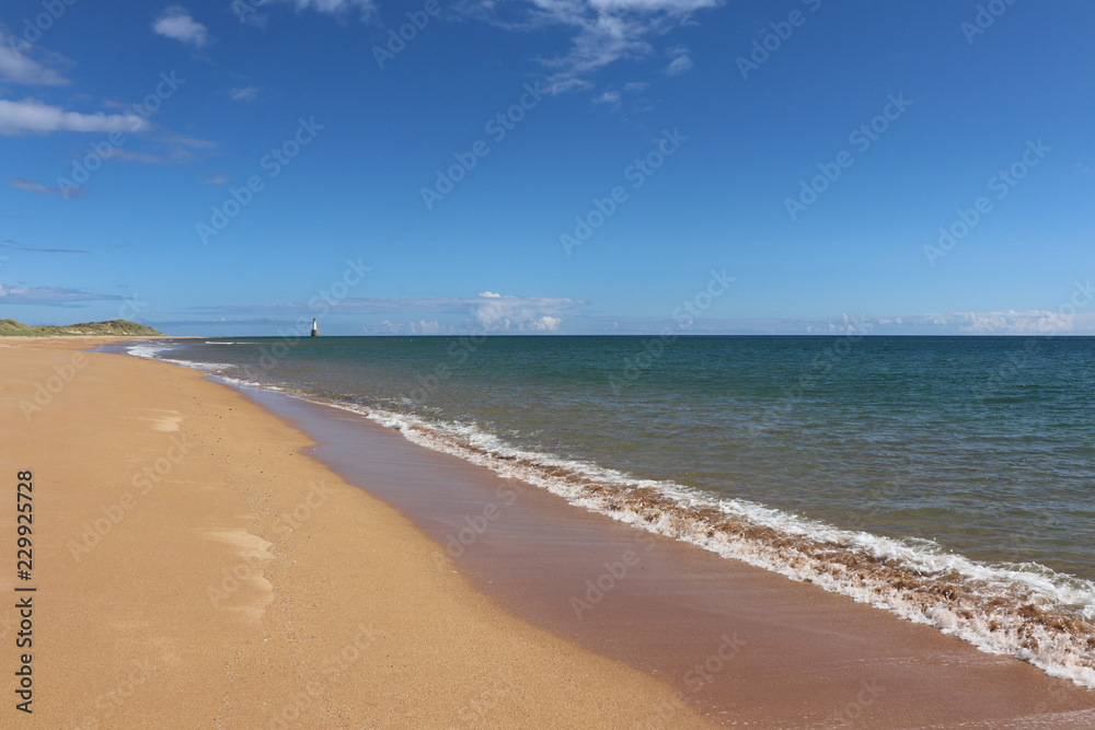 Sand, sea and lighthouse