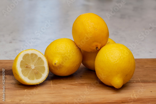 fresh lemons on wooden table