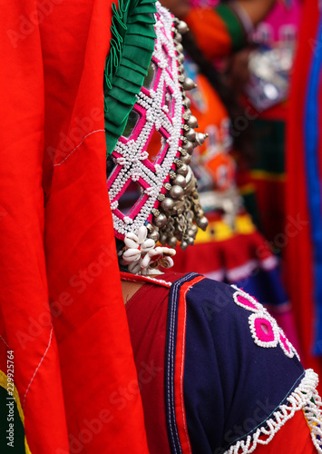 Closeup view of Indian nomadic tribe lambada woman decorated dress and accessories photo