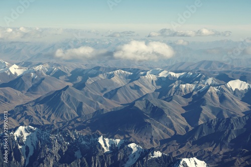Top view of mountain range layers from airplane window, Tiansan, Xinjiang, China