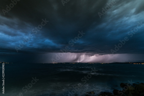 Storm and thunder over Lake Balaton dark clouds over sea wide angle nature photo