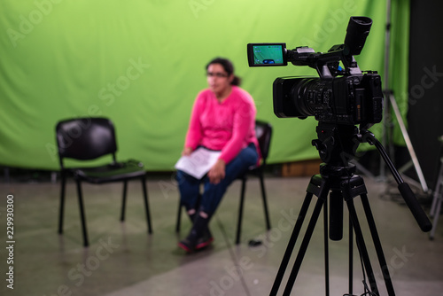 Journalist waiting for the interviewee and practicing speach in a chroma 02