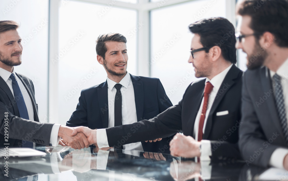 handshake of business partners at a meeting in the office handshake of business partners at a meeting in the office