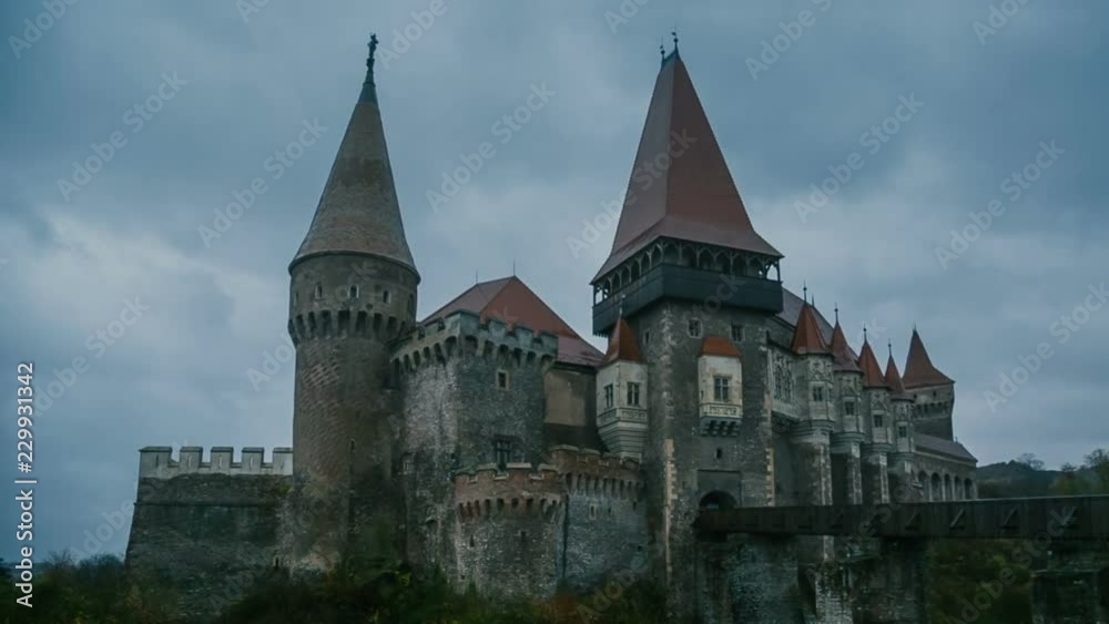Medieval Castle in Transylvania on a cloudy day - pan shot Medieval Castle in Transylvania on a cloudy day - pan shot