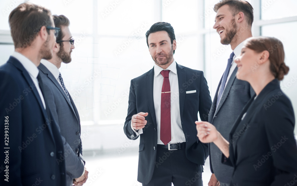 business colleagues discussing a hundred and something standing business colleagues discussing a hundred and something standing