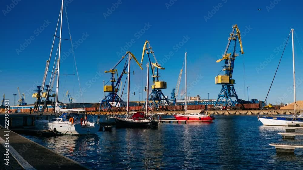 Timelapse of Marina at baltic sea with working cranes in Wismar, Germany with epic clouds during sunny weather Timelapse of Marina at baltic sea with working cranes in Wismar, Germany with epic clouds during sunny weather