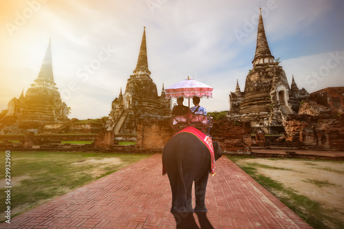 Foreign tourists Elephant ride to visit Ayutthaya, There are ruins and templesi in the Ayutthaya period.Concept is Travel in temple phar sri sanphet. © Suppasit