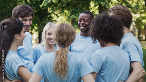 Meeting of young volunteers team in park