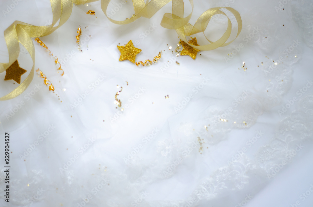Golden ribbon on a white background.Coppy space.. Golden ribbon on a white background.Coppy space..
