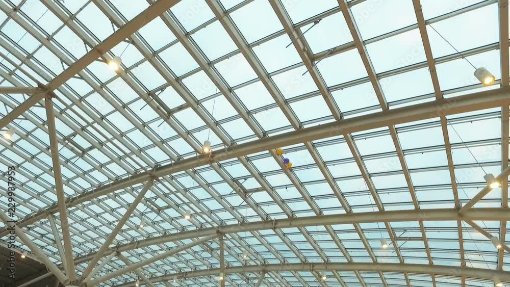 glass roof of a modern building. Overlapping roof of the building glass roof of a modern building. Overlapping roof of the building