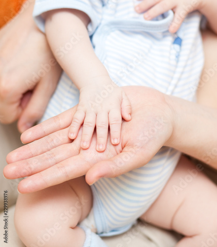 hands -  baby and parents