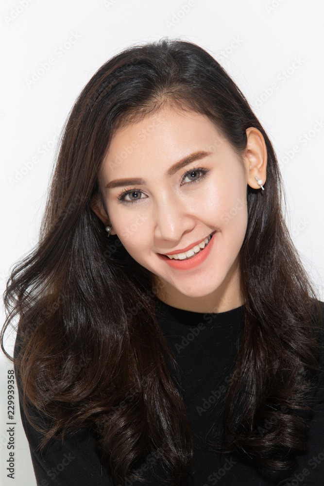 Beautiful smiling woman with clean skin, natural make-up, and white teeth on white background Beautiful smiling woman with clean skin, natural make-up, and white teeth on white background