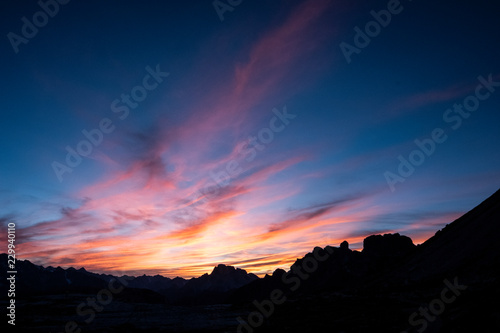 Mountains silhouettes on colorful sunrise