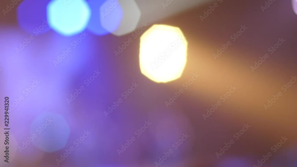 Defocus heptagons of spotlight lumiere flashing and blinking on a concert