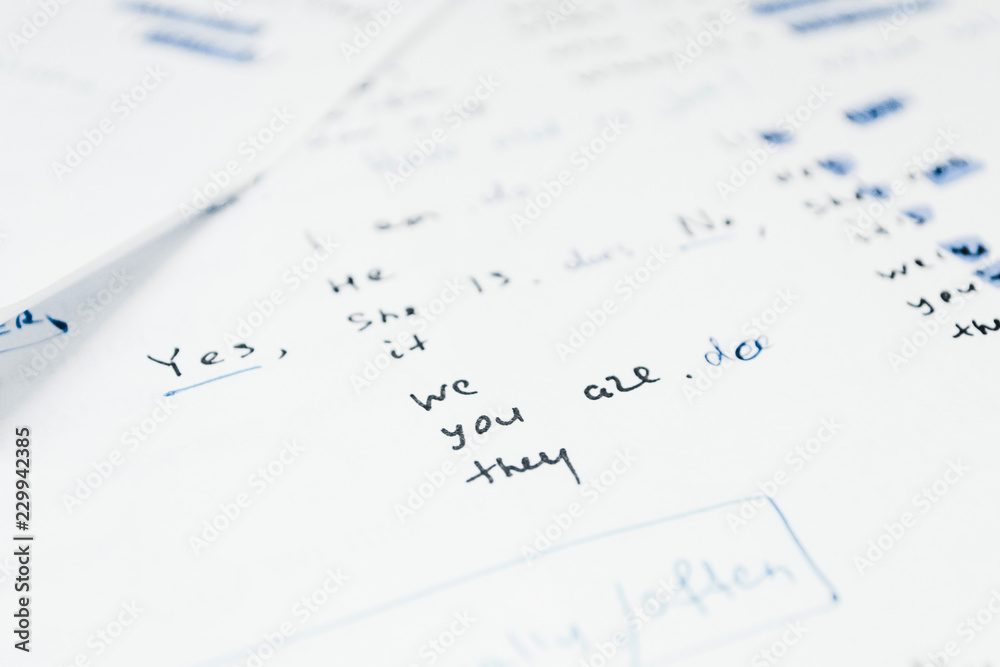 Close-up handwriting English grammar rules on white sheet of paper Close-up handwriting English grammar rules on white sheet of paper
