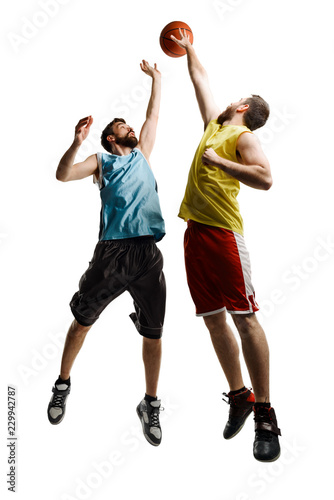 Jumping basketball players on white