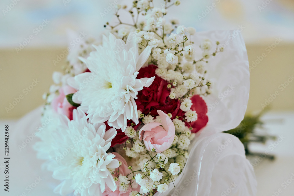 Bridal wedding bouquet of fresh white flowers in bloom