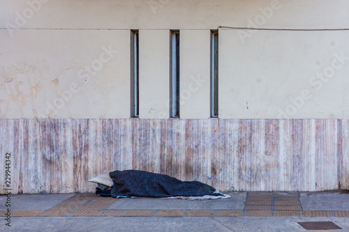 Homeless Person Sleeping on the Streets of Buenos Aires, Argentina photo